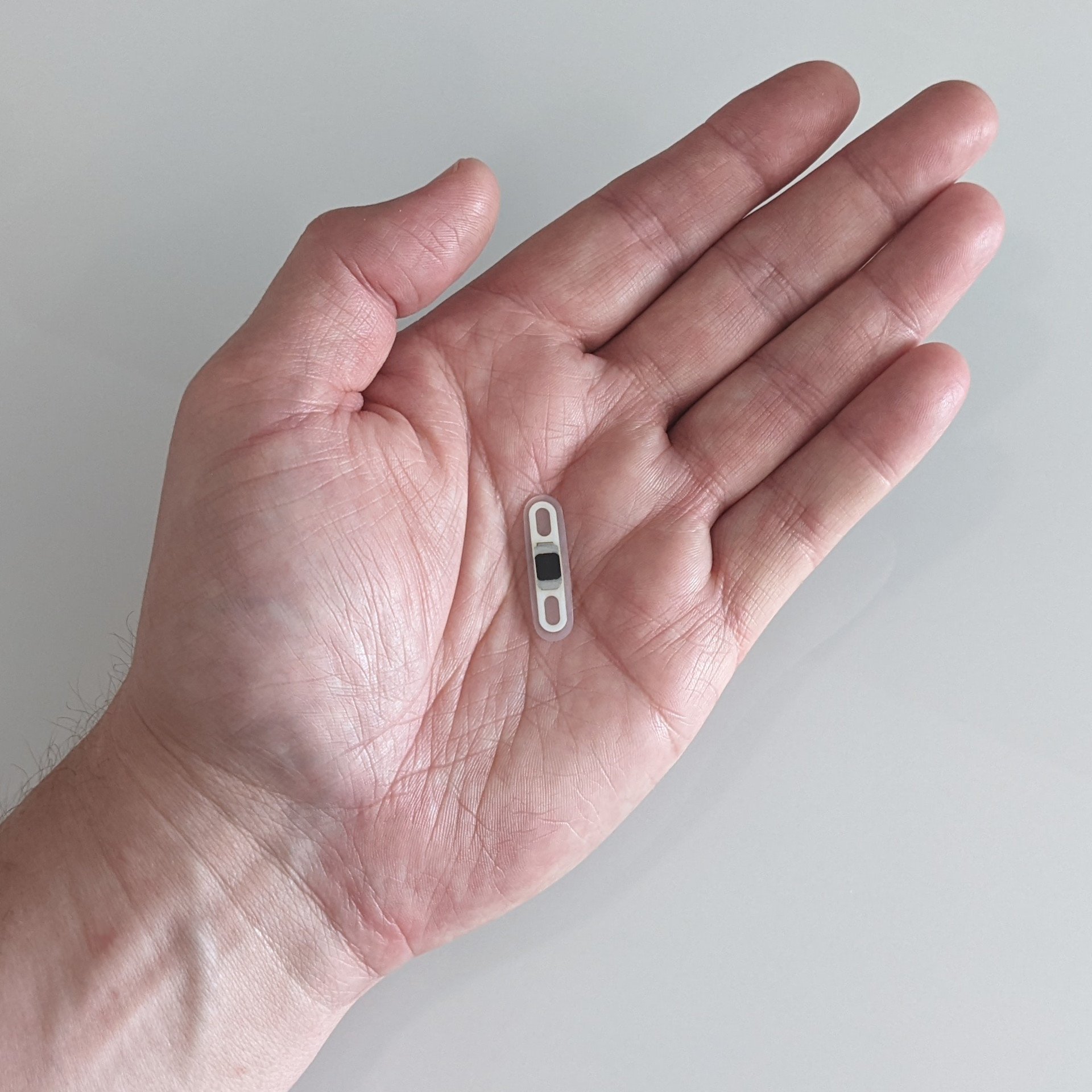 The Apex chip is ultra-thin and designed for easy subdermal implantation. Source: vivokey. com